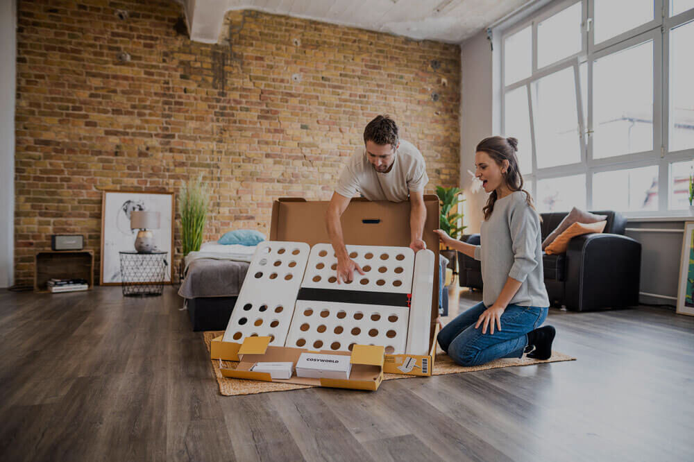 Man and woman unpack the CosyLift package